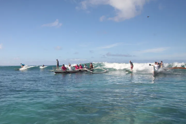 a group of people on a boat in the water