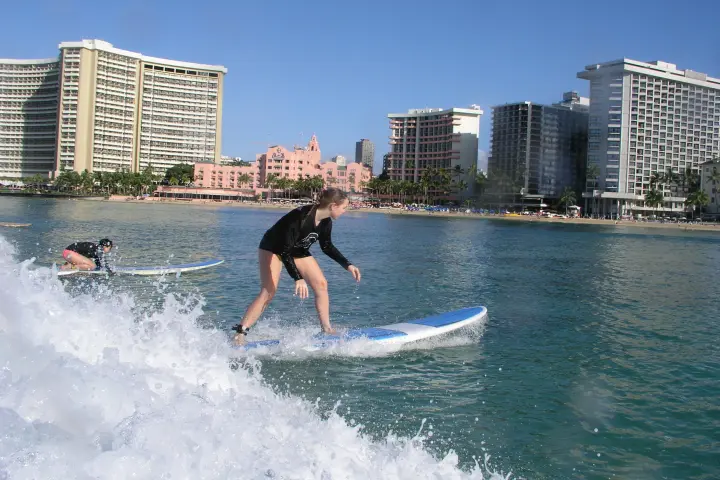 a man riding a wave on a surfboard in the water