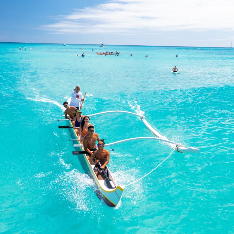 a group of people swimming in the water