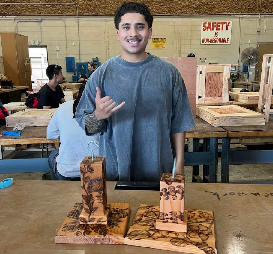 unnamed (16) a man standing in front of a table